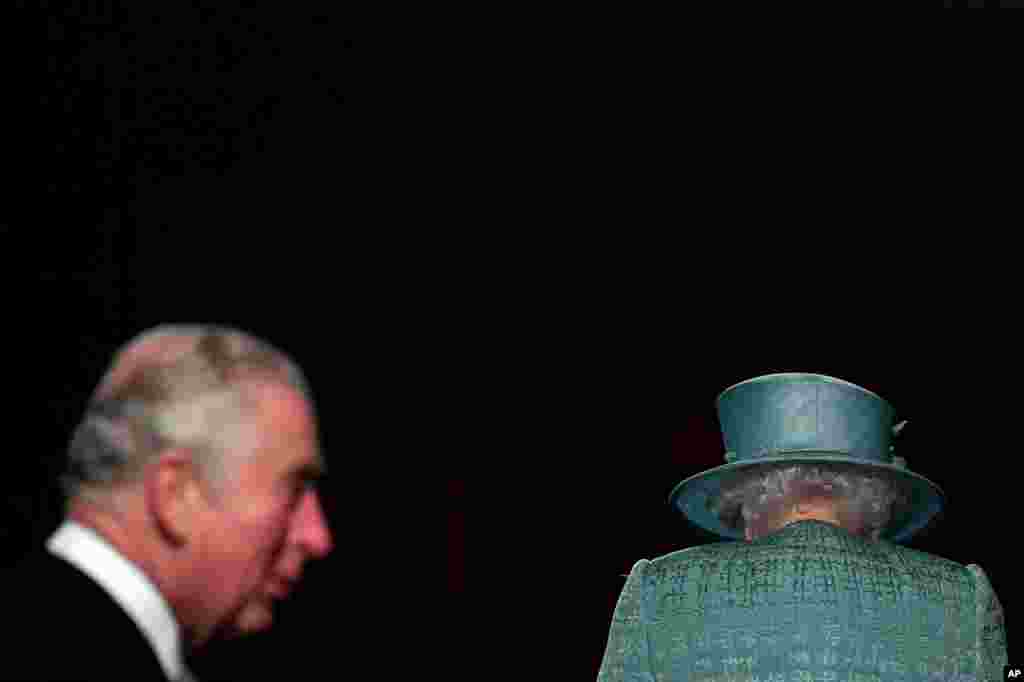 Britain&#39;s Queen Elizabeth and Prince Charles arrive for the State Opening of Parliament at the Houses of Parliament in London.