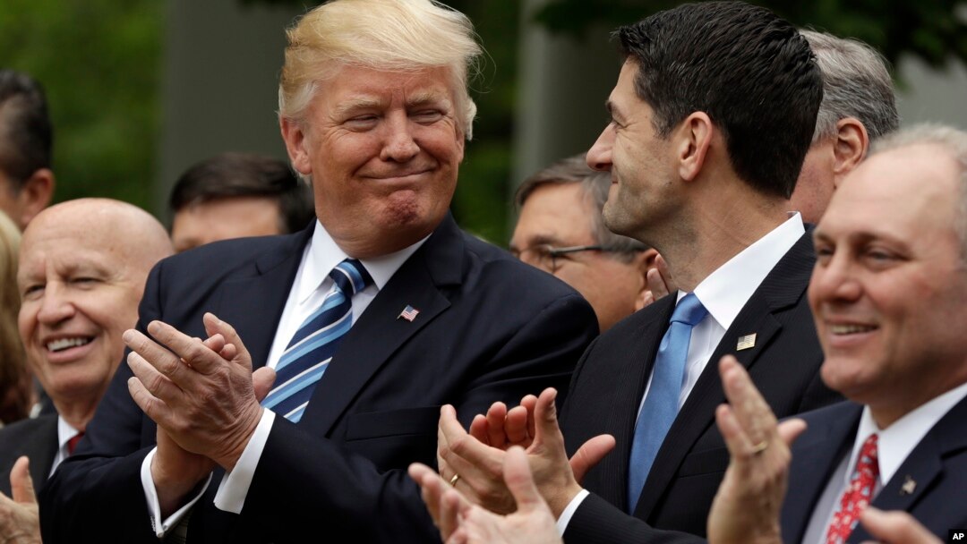 FILE - President Donald Trump acknowledges House Speaker Paul Ryan, in the Rose Garden of the White House in Washington, May 4, 2017, as House Republicans celebrate passage of health care bill to replace former president Barack Obama's signature plan. The Senate has yet to approve the replacement bill.