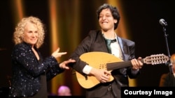 Carole King at the MusiCares Person of the Year ceremony in her honor, with Berklee College of Music student Ahmad El Haggar in Los Angeles, Jan. 24, 2013. (Courtesy Musicares)