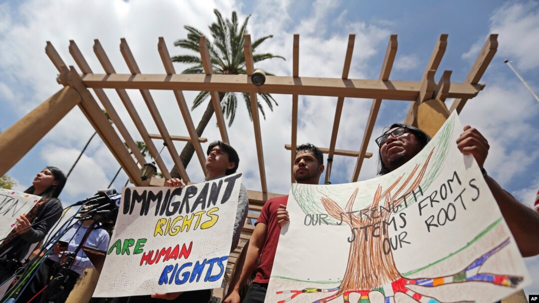 FILE - Supporters of Deferred Action for Childhood Arrivals demonstrate outside a federal courthouse in Pasadena, Calif., May 15, 2018.