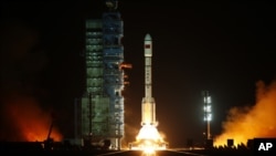 The Long March II-F rocket loaded with China's unmanned space module Tiangong-1 lifts off from the launch pad in the Jiuquan Satellite Launch Center, Gansu province, September 29, 2011.
