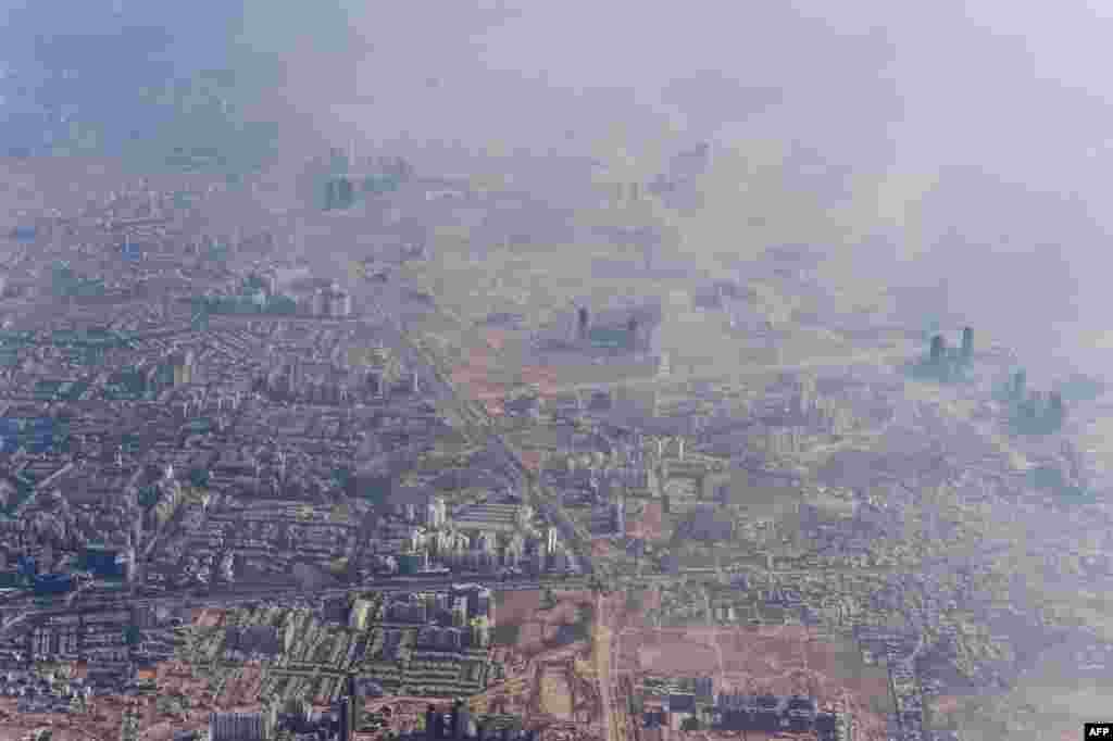 Smog envelops buildings on the outskirts of the Indian capital New Delhi.