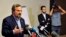 Louay al-Safi, Syrian National Coalition spokesman, left, addressing news conference, Istanbul, May 26, 2013.