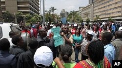 Kenyan teachers call on the government to increase hiring during a protest outside the Parliament building in downtown Nairobi. September 7, 2011.