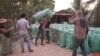 A villager in Srayov commune,​ Kampong Thom province, sold​ rice to a dealer as the price is low, January 19, 2019.