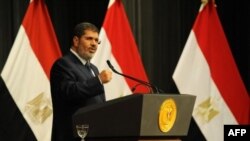 Egyptian President Mohammed Morsi addresses conference June 26, 2013 in Cairo (Egyptian Presidency photo)