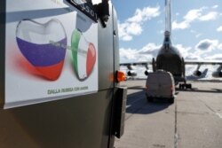 FILE - Russian planes with medical supplies get set to leave for Italy, at a military airdrome in the Moscow region, March 22, 2020. The mission has been dubbed "From Russia With Love."