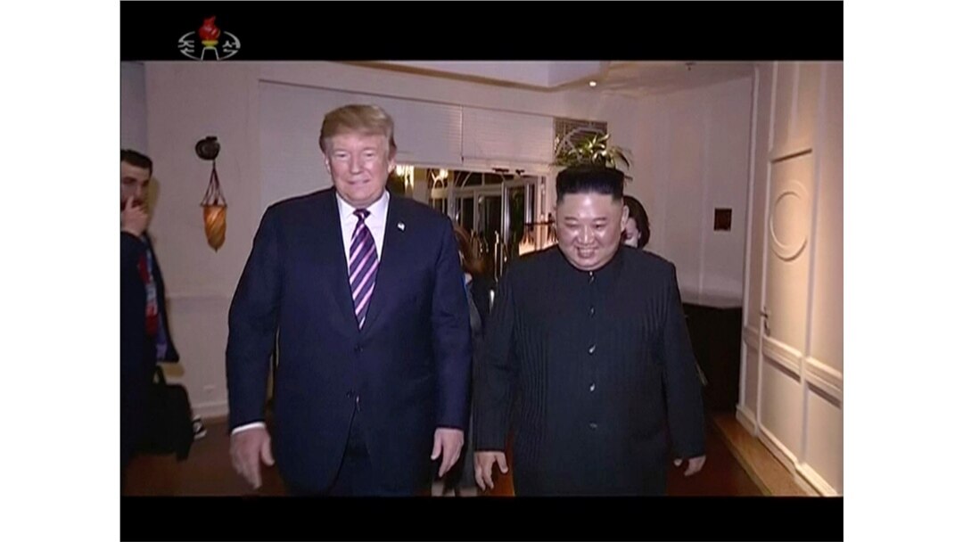 In this image made from video released on Wednesday, March 6, 2019, by North Korean broadcaster KRT, North Korean leader Kim Jong Un, right, smiles while walking with U.S.