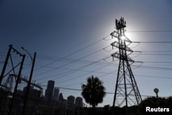 FILE - A general view of electric lines as demand for power surges during a period of hot weather in Houston, Texas, U.S. June 27, 2023. (REUTERS/Callaghan O’Hare/File Photo)
