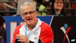 FILE - Gymnastics coach John Geddert is seen at the American Cup gymnastics meet at Madison Square Garden in New York, March 3, 2012.