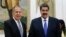 FILE - Venezuelan President Nicolas Maduro, right, shakes hands with Russia's Foreign Minister Sergey Lavrov during a photo opportunity at the end of their meeting at Miraflores presidential palace in Caracas, Venezuela, Feb. 7, 2020. 