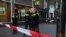 Police officers stand guard to secure the area where Dutch celebrity crime reporter Peter R. de Vries, known for his reporting on some of the most renowned criminals in the Netherlands, was shot and seriously injured, in Amsterdam, July 6, 2021.