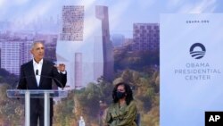 Former President Barack Obama speaks as former first lady Michelle Obama listens during a groundbreaking ceremony for the Obama Presidential Center in Chicago, Sept. 28, 2021.