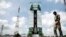 A paramilitary soldier walks past the Polar Satellite Launch Vehicle (PSLV-C25) at the Satish Dhawan Space Center at Sriharikota, in the southern Indian state of Andhra Pradesh, Oct. 30, 2013. 