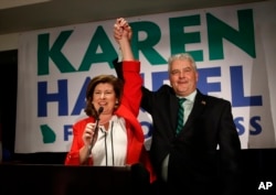 Republican candidate for Georgia's 6th District Congressional seat Karen Handel celebrates with her husband Steve as she declares victory during an election-night watch party, June 20, 2017, in Atlanta.