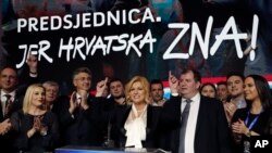 Incumbent president and presidential candidate Kolinda Grabar Kitarovic, center, addresses to her supporters in Zagreb, Croatia, Jan. 5, 2020. 