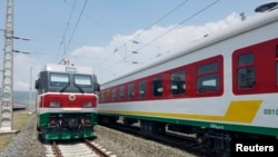 Locomotives for the new Ethiopia to Djibouti electric railway system sit outside a train station on the outskirts of Addis Ababa. Sept. 24, 2016, 