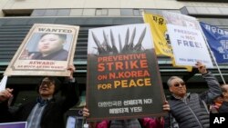 FILE - South Koreans protest against North Korea and Kim Jong Un during a rally near the U.S. Embassy in Seoul, South Korea, Nov. 6, 2017.