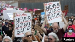 FILE: Abortion rights protesters participate in nationwide demonstrations, in New York City, May 14, 2022. The leaked draft from the Supreme Court has brought both persons supporting abortion rights and foes to their feet to voice their views. 