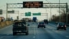 A highway sign on Interstate 75 advises travelers to limit travel in order to slow the spread of the novel coronavirus (COVID-19), in Cincinnati, Ohio, March 17, 2020.