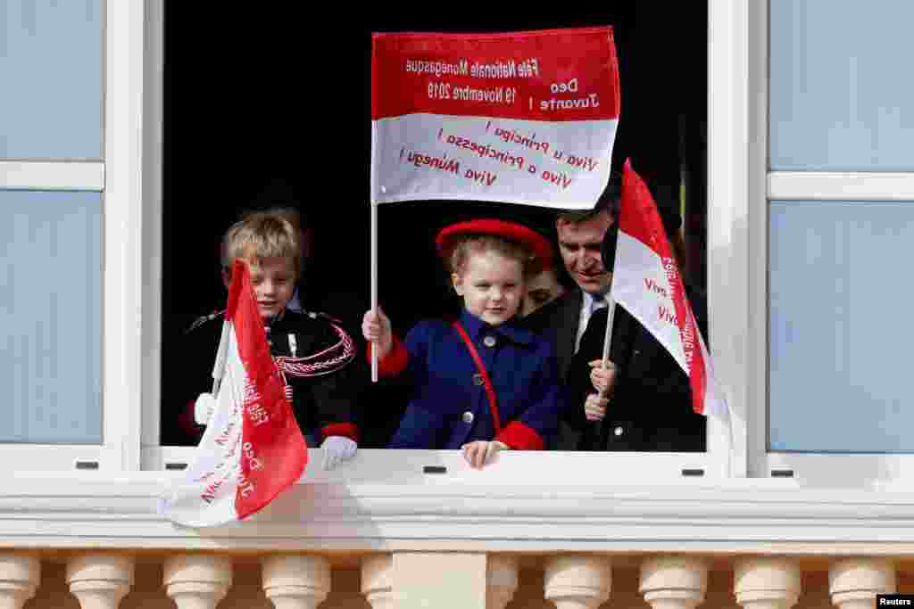 Monaco&#39;s Prince Jacques and Princess Gabriella stand on the palace balcony during the celebrations marking Monaco&#39;s National Day.
