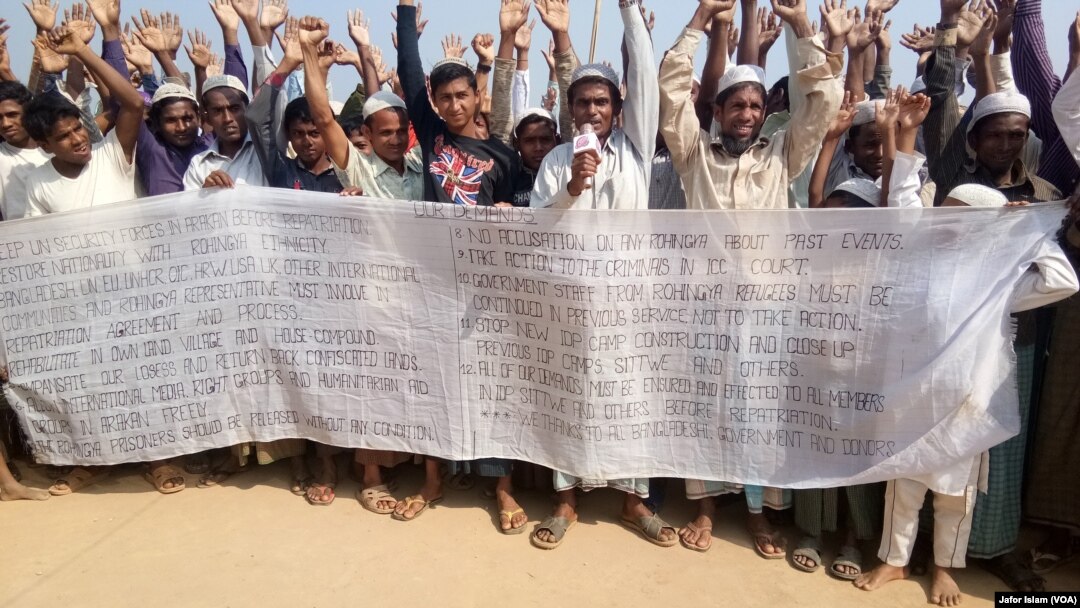 Some Rohingya refugees in Cox's Bazar, Bangladesh, are protesting against the community's repatriation to Myanmar, carrying a festoon on which their demands for repatriation are written. 