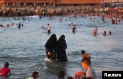 Palestinians enjoy the beach in Gaza City on June 8, 2022. (REUTERS/Mohammed Salem)