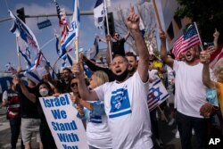 FILE - Pro-Israel supporters chant slogans during a rally in support of Israel outside the Federal Building in Los Angeles, May 12, 2021.