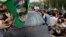 Supporters of former Pakistani Prime Minister Nawaz Sharif crowd around his car as his convoy leaves Islamabad, Pakistan, Aug. 9, 2017. 