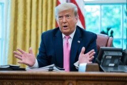 President Donald Trump speaks during a meeting with Senate Majority Leader Mitch McConnell of Ky., and House Minority Leader Kevin McCarthy of Calif., in the Oval Office of the White House, July 20, 2020, in Washington.