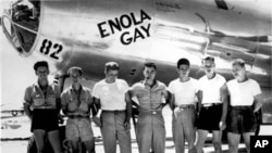 This undated U.S. Air Force photograph shows the ground crew of the "Enola Gay" airplane that bombed Hiroshima, Japan on August 6, 1945 with the "Little Boy" nuclear bomb