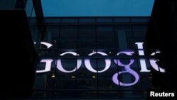 The sign marking the Google offices is lit up in Cambridge, Massachusetts, U.S., June 27, 2017. 