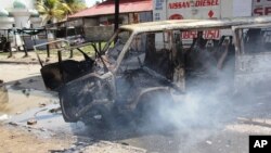 A burning vehicle which was set on fire by protesting Muslim youths after Islamic cleric Aboud Rogo Mohammed was killed in Mombasa, Kenya, Aug. 27, 2012. 