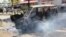 A burning vehicle which was set on fire by protesting Muslim youths after Islamic cleric Aboud Rogo Mohammed was killed in Mombasa, Kenya, Aug. 27, 2012. 
