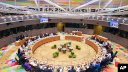 European Union leaders attend a round table meeting at an EU summit in Brussels, Friday, June 21, 2019. EU leaders conclude a two-day summit on Friday in which they will discuss the euro-area. (Stephanie Lecocq, Pool Photo via AP)