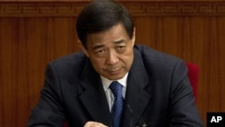 Then Chongqing party secretary Bo Xilai attends a plenary session of the National People's Congress at the Great Hall of the People in Beijing, March 11, 2012. 