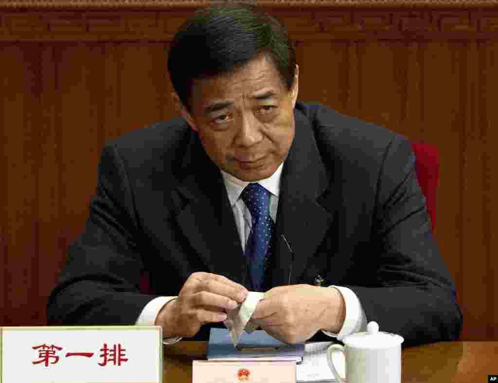 Then Chongqing party secretary Bo Xilai attends a plenary session of the National People's Congress at the Great Hall of the People in Beijing, March 11, 2012. 