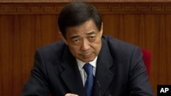 Then Chongqing party secretary Bo Xilai attends a plenary session of the National People's Congress at the Great Hall of the People in Beijing, March 11, 2012.