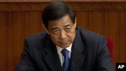 Then Chongqing party secretary Bo Xilai attends a plenary session of the National People's Congress at the Great Hall of the People in Beijing, March 11, 2012. 