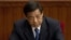 Then Chongqing party secretary Bo Xilai attends a plenary session of the National People's Congress at the Great Hall of the People in Beijing, March 11, 2012. 
