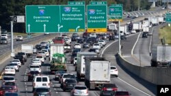 FILE - Heavy traffic heads north in preparation for Hurricane Irma, Friday, Sept. 8, 2017, in Forrest Park, south of Atlanta. (AP Photo/Mike Stewart)