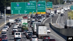 FILE - Heavy traffic heads north in preparation for Hurricane Irma, Friday, Sept. 8, 2017, in Forrest Park, south of Atlanta. (AP Photo/Mike Stewart)