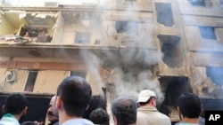  a damaged building that destroyed by a car bomb, at Jaramana neighborhood, in Damascus, Syria, Monday Oct. 29, 2012