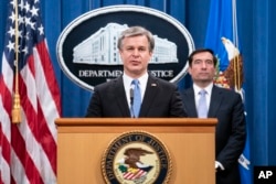 Justice Department China FBI Director Christopher Wray speaks during a virtual news conference at the Department of Justice, Wednesday, Oct. 28, 2020 in Washington, as Assistant Attorney General for National