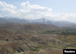 Smokes rises after U.S airstrike hit the site of insurgent activity in Nangarhar province, Afghanistan, July 7, 2018.