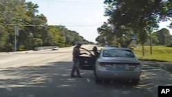 Frame from a dashcam video provided by the Texas Department of Public Safety shows a heated confrontation between trooper Brian Encinia with Sandra Bland after a minor traffic infraction, July 10, 2015.