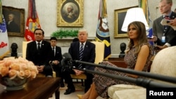 U.S. President Donald Trump and first lady Melania Trump welcome Thai Prime Minister Prayut Chan-o-Cha to the Oval Office of the White House in Washington, U.S., October 2, 2017