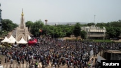 FILE - Supporters of the Imam Mahmoud Dicko and other opposition political parties attend a mass protest demanding the resignation of Mali's President Ibrahim Boubacar Keita at Independence Square in Bamako, Mali, June 5, 2020. 