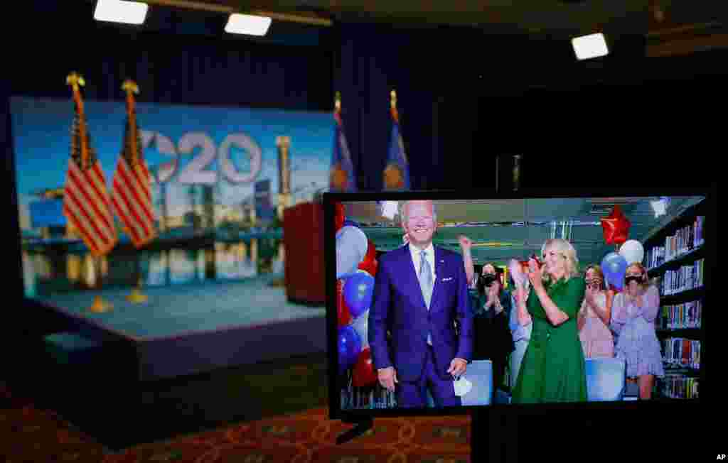 Democratic presidential candidate former Vice President Joe Biden is seen in a video feed from Delaware with his wife Jill Biden and his grandchildren, during the virtual 2020 Democratic National Convention in Milwaukee, Wisconsin, Aug. 18, 2020.
