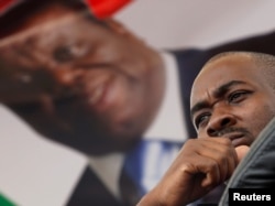 FILE - Nelson Chamisa, the new leader for Movement For Democratic Change (MDC), looks on during the funeral parade of Morgan Tsvangirai in Harare, Feb. 19, 2018.